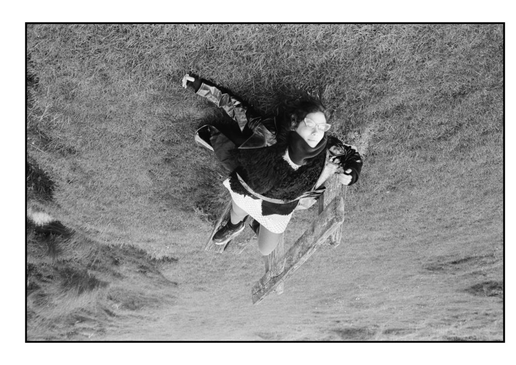 A woman lying on a bench