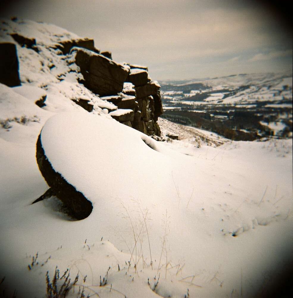 Bamford Edge millstone in the snow