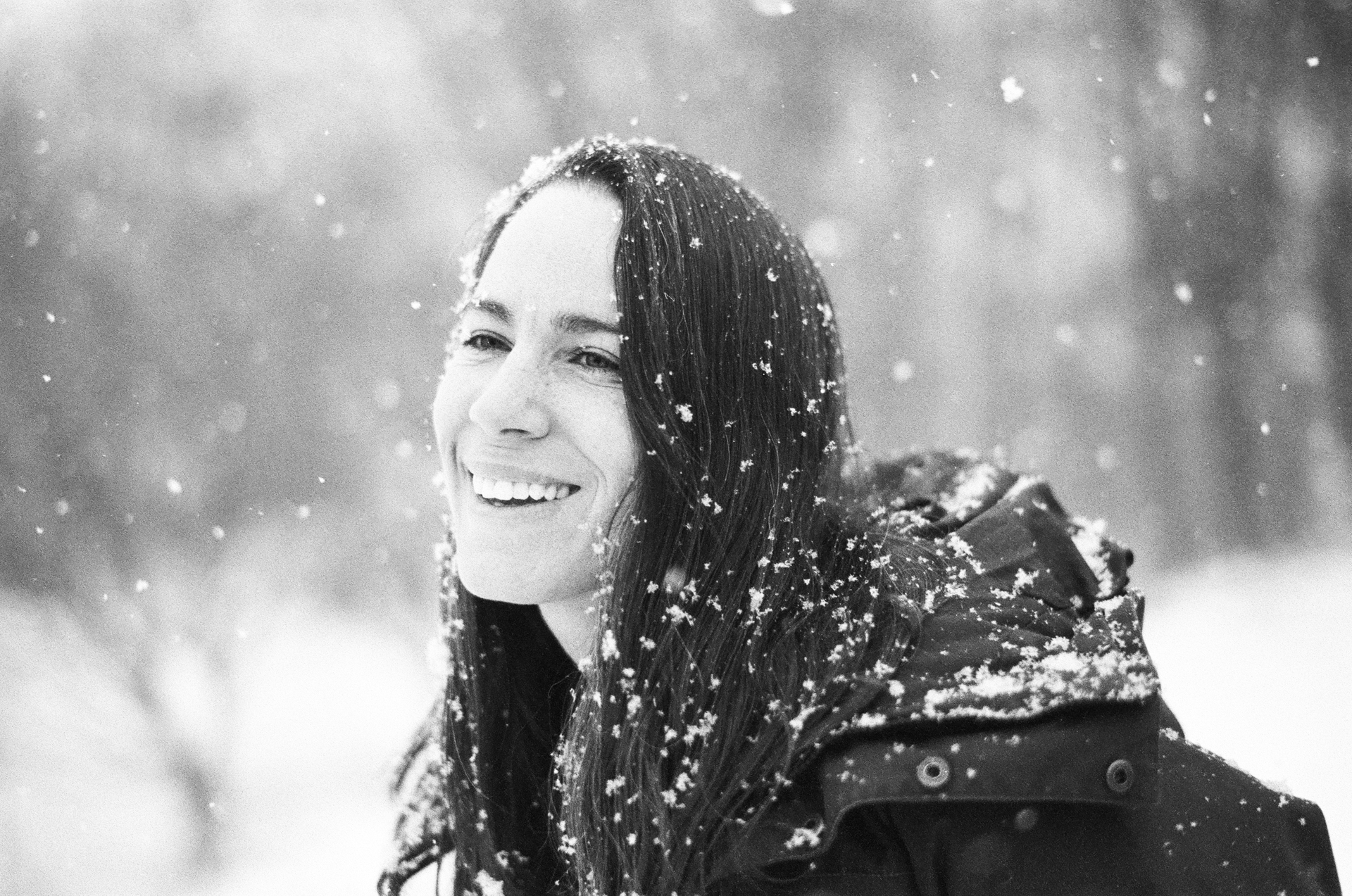 Woman standing in snowstorm