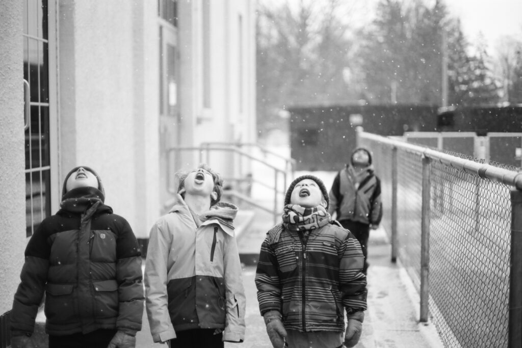 Kids catching snowflakes