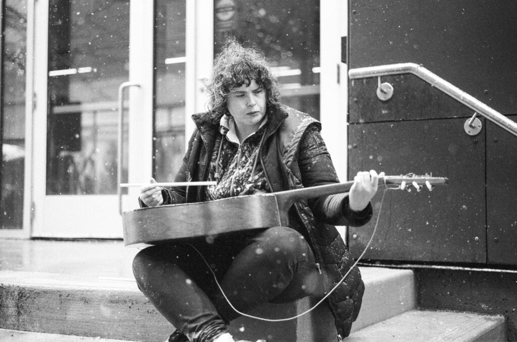 Woman busking in the snow