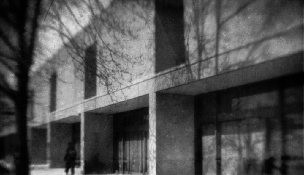 Person walking next to academic building