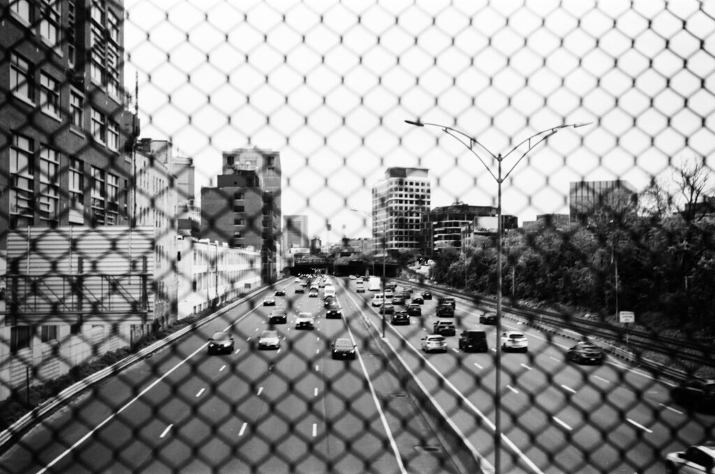 A shot of the highway behind a fence