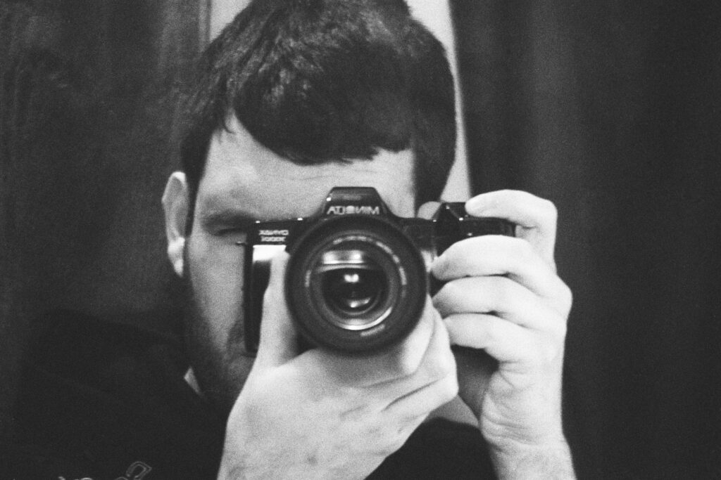 Self Portrait of Vladi with a Minolta 7000i.