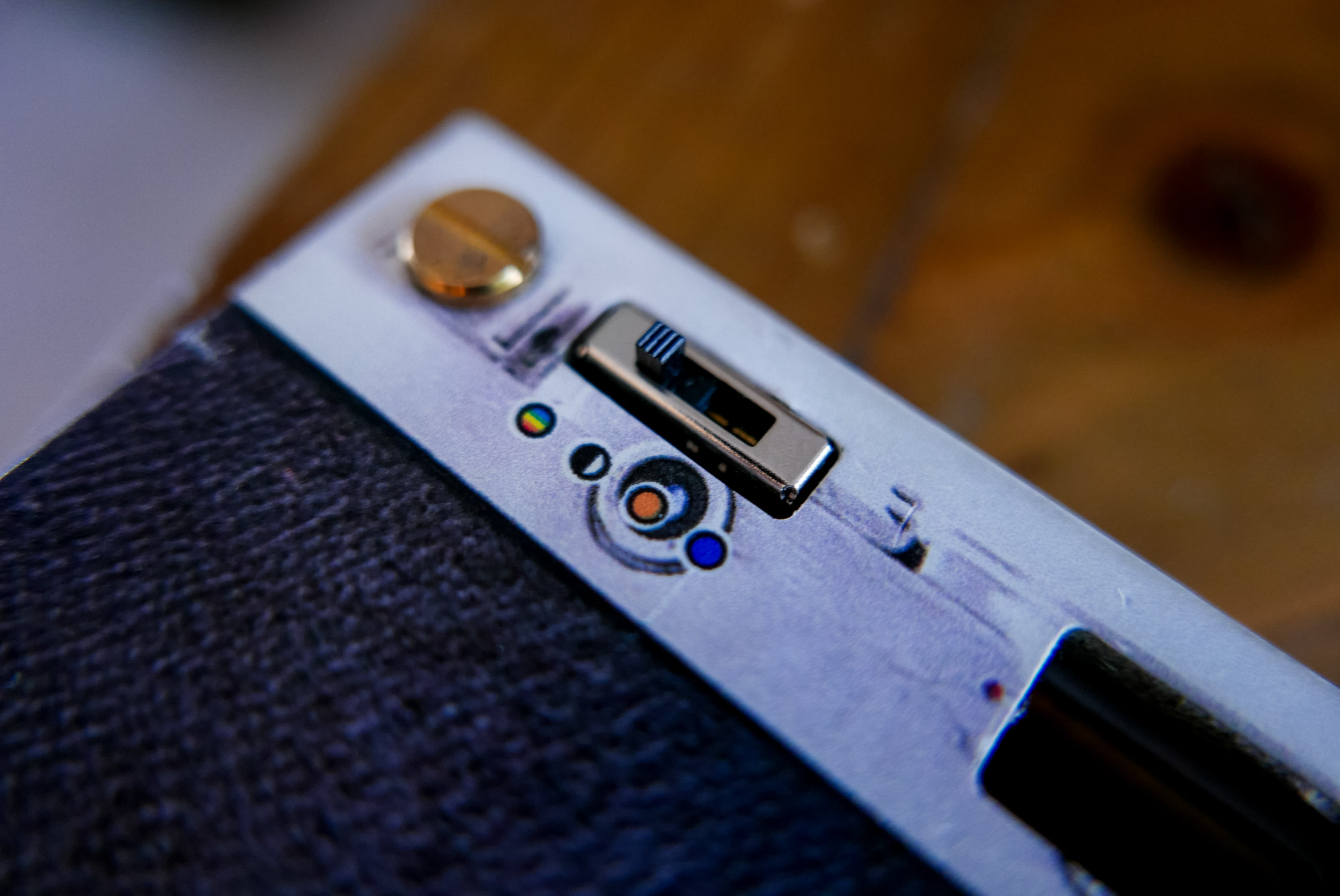 A large illuminated sign saying "East Village Arts Club".