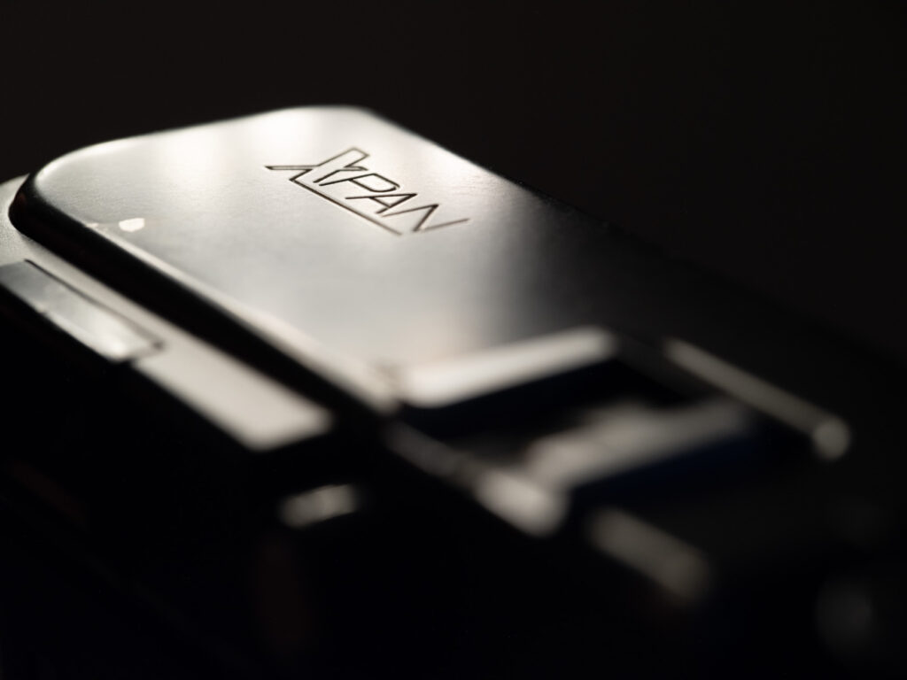 A close up of the Hasselblad XPan camera logo under light